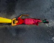 A woman laying on the floor.